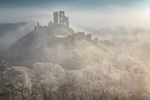 Foggy Collection: The impressive ruins of Corfe Castle on a chill winter morning in the Purbecks, Dorset, England