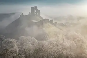 The impressive ruins of Corfe Castle on a chill winter morning in the Purbecks, Dorset, England. Winter (February) 2023