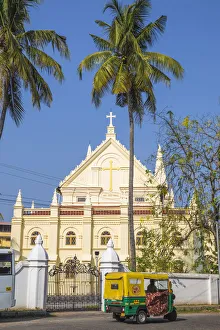 Images Dated 30th April 2020: India, Kerala, Cochin - Kochi, Fort Kochi, Auto rickshaw passing infront of the Santa