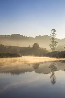 India, Kerala, Munnar, Early morning mist on Muthirappuzhayar River