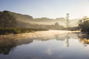 India, Kerala, Munnar, Early morning mist on Muthirappuzhayar River