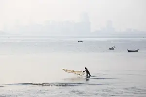 Early Morning Prints: India, Maharashtra, Mumbai, Chowpatty, Man fishing