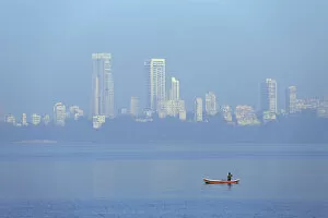 Images Dated 6th February 2014: India, Maharashtra, Mumbai, a fisherman in a traditional boat fishing off Nariman Point