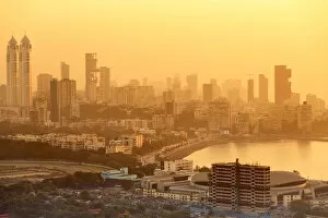 Mumbai Gallery: India, Maharashtra, Mumbai, sunset over the city centre and Haji Ali Bay showing the