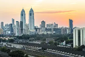 India, Maharashtra, Mumbai, sunset over the city centre and railway sheds outside