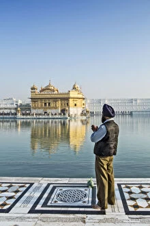 Prayer Gallery: India, Punjab, Amritsar, a sikh pilgrim praying at the Golden Temple - the holiest