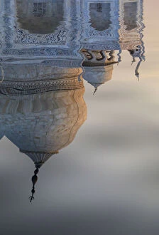 India, reflection of the Taj Mahal dome in the Yamuna river at sunset