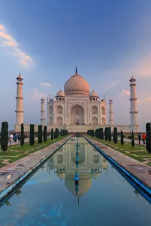 India, Taj Mahal mausoleum in the early morning reflecting in the water pool India, Taj Mahal mausoleum in the early morning reflecting in the water pool