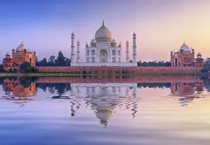 India, the Taj Mahal mausoleum reflecting in the Yamuna river at sunset