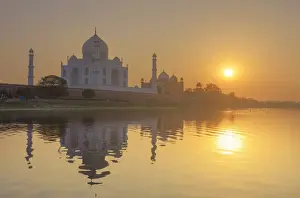 India, the Taj Mahal mausoleum reflecting in the Yamuna river at sunset