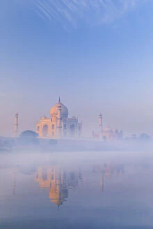 Images Dated 5th April 2018: India, Taj Mahal reflecting in the Yamuna river on a foggy morning