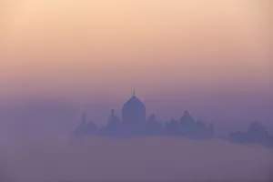 Agra Prints: India, Taj Mahal silhouette at dawn on a foggy morning