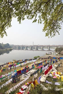 India, Uttar Pradesh, Lucknow, Washing drying on banks of Gomti River with