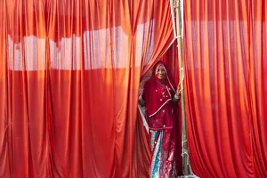 Images Dated 27th November 2012: Indian woman leaving tent, Pushkar, Rajasthan State, India