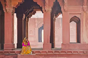 Indian Woman Sitting in Archway, Jodha Bais Palace, Fatehpur Sikri, Agra, India