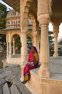 Sari Prints: Indian woman watching sunset, Village of Pachewar, Rajasthan, India, Asia