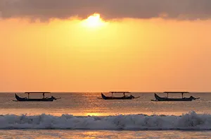 Images Dated 28th November 2019: Indonesia, Bali, Kuta; fishing outriggers on the beach of Kuta; at sunset