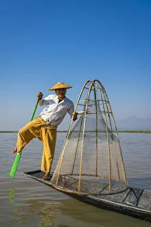 Intha fisherman with a traditional conical fishing, Lake Inle, Nyaungshwe Township Intha fisherman with a traditional conical fishing, Lake Inle, Nyaungshwe Township