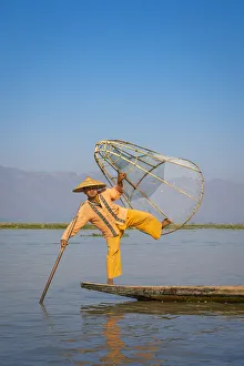 Intha fisherman with a traditional conical fishing, Lake Inle, Nyaungshwe Township