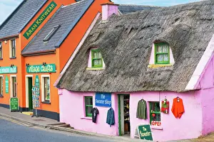 County Clare Prints: Ireland, Co. Clare, Doolin, colourful street with traditional thatched cottage