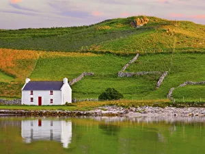 Ireland, Co. Donegal, Rosapenna, Downings, traditional Irish, cottage reflected (PR)