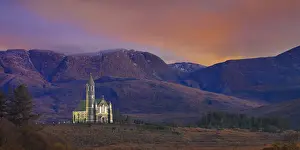 Ireland, Co. Donegal, Sacred heart church at Dunlewey illuminated at dusk