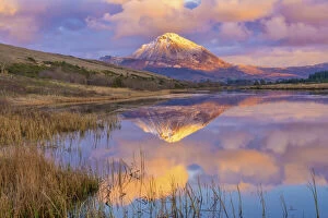 Images Dated 8th April 2021: Ireland, Co. Donegal, Snow capped Errigal mountain reflected in Clady river at dusk