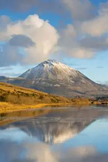 Ireland, Co. Donegal, Snow capped Errigal mountain reflected in Clady river
