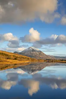 Ireland, Co. Donegal, Snow capped Errigal mountain reflected in Clady river