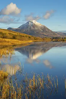 Ireland, Co. Donegal, Snow capped Errigal mountain reflected in Clady river