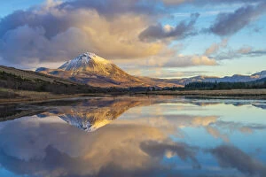 Images Dated 8th April 2021: Ireland, Co.Donegal, Snow capped Errigal mountain reflected in Clady river at dusk