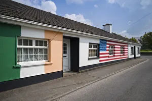 President Prints: Ireland, County Offaly, Moneygall, house painted with Irish and US flags for visit