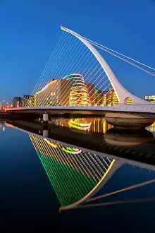 Wharf Prints: Ireland, Dublin, River Liffey, Samuel Beckett Bridge and convention centre at dusk