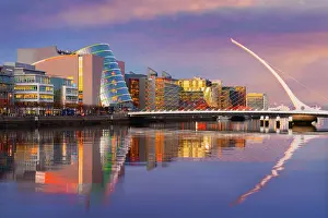 Wharf Prints: Ireland, Dublin, River Liffey, Samuel Beckett Bridge and convention centre at dusk