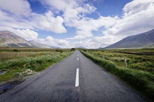 Irish road into the green landscape. Ireland, Europe