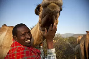 Isiolo, Northern Kenya. A traditional Somali pastoralist with a camel in his Boma