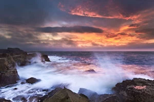 Isle of Skye, Scotland. Big waves crashing into rocks at first light
