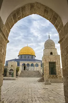 Israel, Jerusalem, Temple Mount, Man walking past Dome of the Rock and Sabil of Qairbay