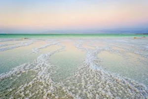 Israel, South District, Ein Bokek. Salt formations on the Dead Sea at sunset