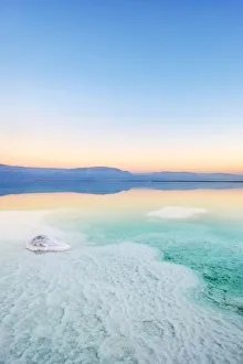 Israel, South District, Ein Bokek. Salt formations on the Dead Sea at sunset