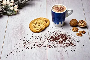 Italian cappuccino with cookies and walnuts on a white wooden table Italian cappuccino with cookies and walnuts on a white wooden table