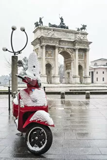 Snowfall Collection: Italian vespa and Arch of Peace with snow. Milan, Lombardy, Italy