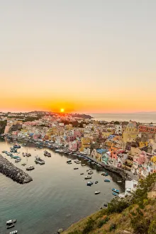 Italy, Campania, Province of Naples, Procida. Sunset at Marina di Corricella