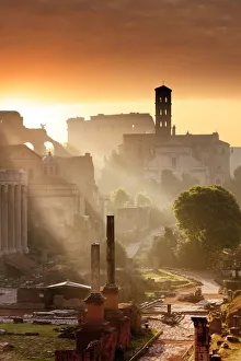 Italy, Rome, Colosseum and Roman Forum at sunrise