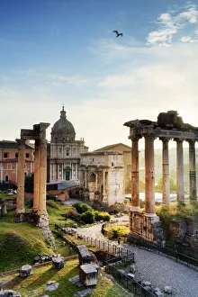 Italy, Rome, Colosseum and Roman Forum at sunrise