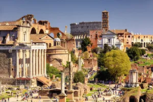 Italy, Rome, Colosseum and Roman Forum at sunset