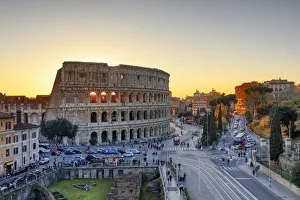 Italy, Rome, Colosseum and Roman Forum at sunset