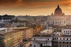 Italy, Rome, St. Peter Basilica and Via della Conciliazione elevated view at sunset