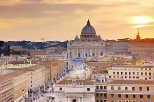 Italy, Rome, St. Peter Basilica and Via della Conciliazione elevated view at sunset