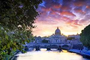 Italy, Rome, St. Peter Basilica by night reflecting on Tevere river